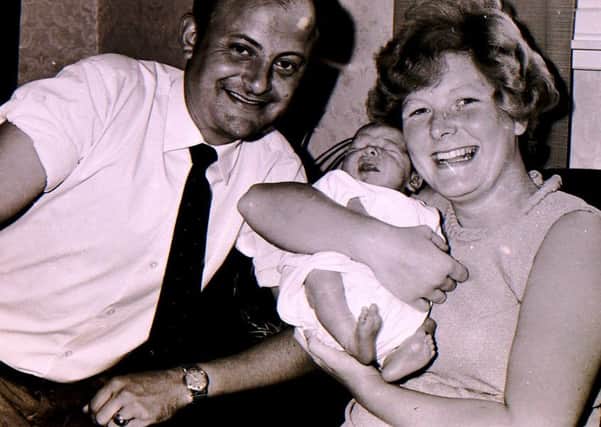 New moon landing baby Gary Wilson with his proud parents 50 years ago after they won a competition in the Sleaford Standard. EMN-190717-172811001