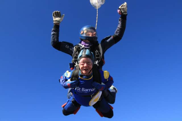 Sheila Robinson mid-air at last year's skydive EMN-190530-143741001