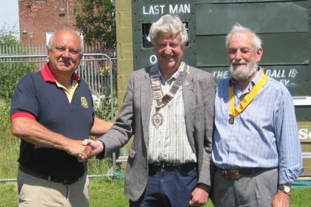 Neil Taylor, left, hands over the chain of office to Jo Bowman, President 2019-20. President Elect for 2020-21is Alan Lakeman, right. EMN-190723-093552001
