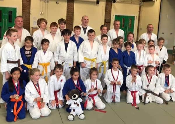 A group shot of the judo aces.