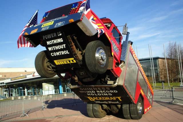 Mian ring stunts with the wheelie fire engine. EMN-190723-154348001
