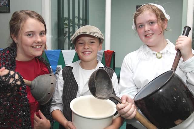 Pupils from Spilsby Primary School used imperial measurements and Victorian pans to cook up some treats for visitors 10 years ago. Pictured, from left, were Shauna Dawson, Charlie Shudell and Rose Kirk.