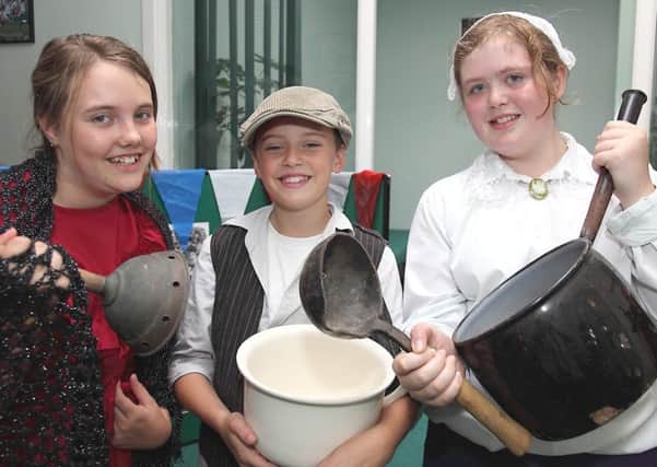Pupils from Spilsby Primary School used imperial measurements and Victorian pans to cook up some treats for visitors 10 years ago. Pictured, from left, were Shauna Dawson, Charlie Shudell and Rose Kirk.