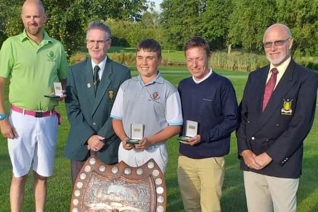 The winning Sleaford team, Dan Withers (left), Michael Baines (centre), and Dillon Ormesher (second right) with the sizeable Lunn Shield EMN-190718-124405002