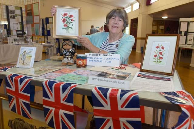 Centenary of Peace Day at Market Rasen. Gillian Anderton on the Armed Forces and Veterans Breakfast Club stall, in Festival Hall. EMN-190721-220654001