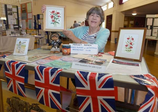 Centenary of Peace Day at Market Rasen. Gillian Anderton on the Armed Forces and Veterans Breakfast Club stall, in Festival Hall. EMN-190721-220654001