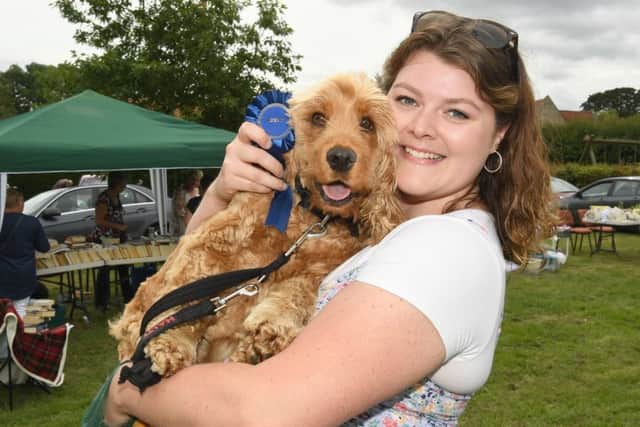 Aisby village fete with shoebox car races. Emma Jones with her dog Charlie, winner of Doggy Musical Sit EMN-190722-101419001
