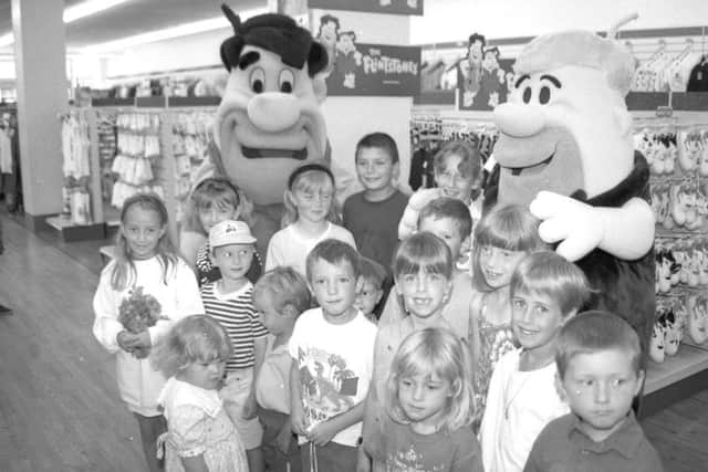 A page right out of history ... Youngsters at Woolworths, in Strait Bargate, Boston, 20 years ago this week, with Fred Flintstone and best friend and next-door neighbour Barney Rubble.