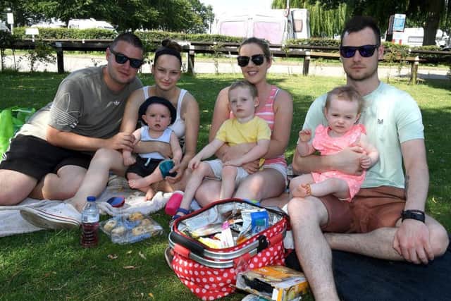 L-R James White, Shannon Noble with 8-month-old Freddie White, Vicky Pickwell with Ollie Hardwick 3, Nick Hardwick with Lottie Hardwick 1, enjoying the weather at Woodhall Spa. EMN-190726-092527001