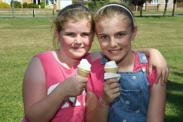 L-R Abby 8 and Libby of Boston, enjoying the weather at Woodhall Spa. EMN-190726-092616001