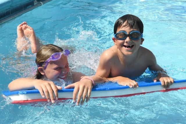 L-R Mia Lassmans and Aidan Eadsforth of Coningsby, at Billinghay swimming pool. EMN-190726-092713001