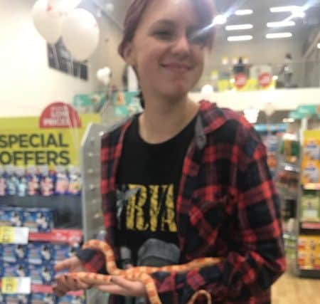 Layla Mullroy of Peterborough says hello to a snake. ANL-190728-131112001