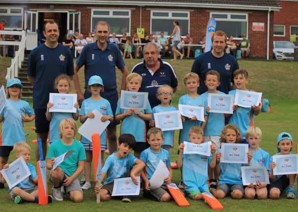All Stars at Caistor after being presented with their certificates by club chairman Ben Jacob, with coaches Pete Briggs, Andy Blackburn and Jim Parker. Picture: Wes Allison EMN-190729-104942002