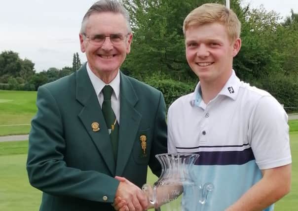 Sam with the Lincolnshire Poacher trophy and county president Harvey Harrison EMN-190729-134204002