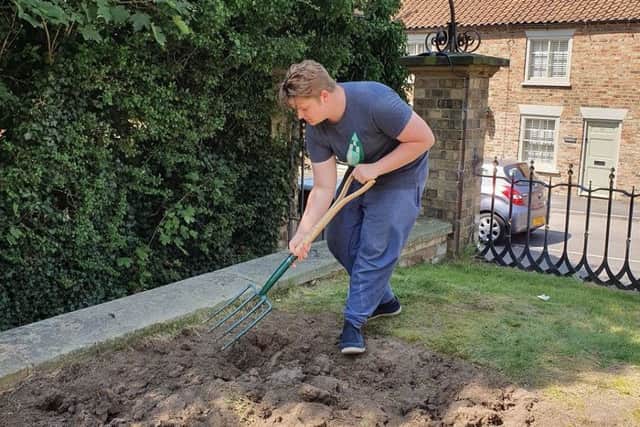 Members of the group doing the hard work in last Thursday's blazing heat.