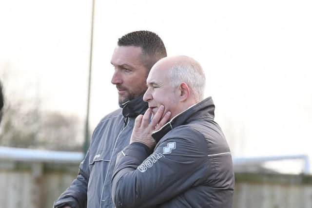 Collins, left, and assistant Nick Chapman.