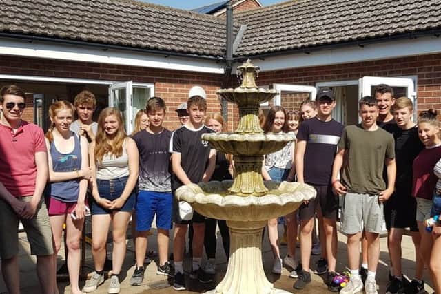 NCS team members in the completed garden project at St Andrew's Nursing Home, Ewerby. EMN-190726-140606001