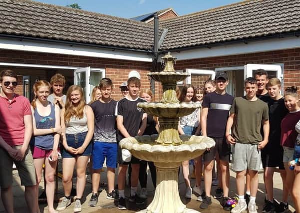 NCS team members in the completed garden project at St Andrew's Nursing Home, Ewerby. EMN-190726-140606001