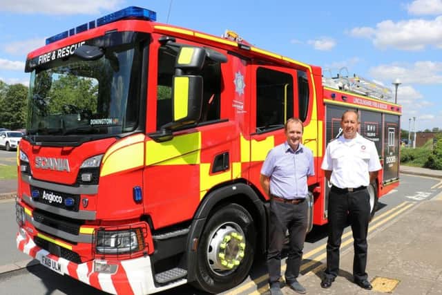 Chief Fire Officer for Lincolnshire, Les Britzman, pictured with Coun Nick Worth, portfolio holder for emergency services at the county council, and one of the new fire appliances. EMN-190730-152851001