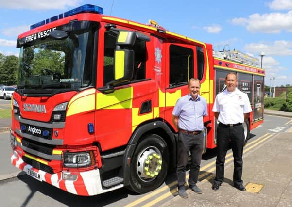 Chief Fire Officer for Lincolnshire, Les Britzman, pictured with Coun Nick Worth, portfolio holder for emergency services at the county council, and one of the new fire appliances. EMN-190730-152851001