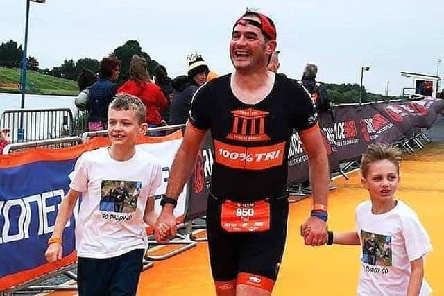 Paul Thorpe with his two children Joseph and Izzy on the finish chute EMN-190108-121607002