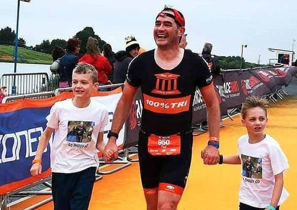 Paul Thorpe with his two children Joseph and Izzy on the finish chute EMN-190108-121607002