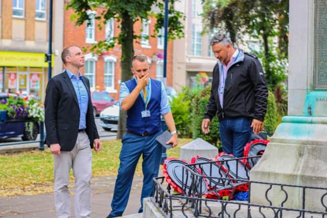 MP Matt Warman, council leader Aaron Spencer and councillor Paul Skinner inspect the scene at the war memorial where a man was filmed urinating.