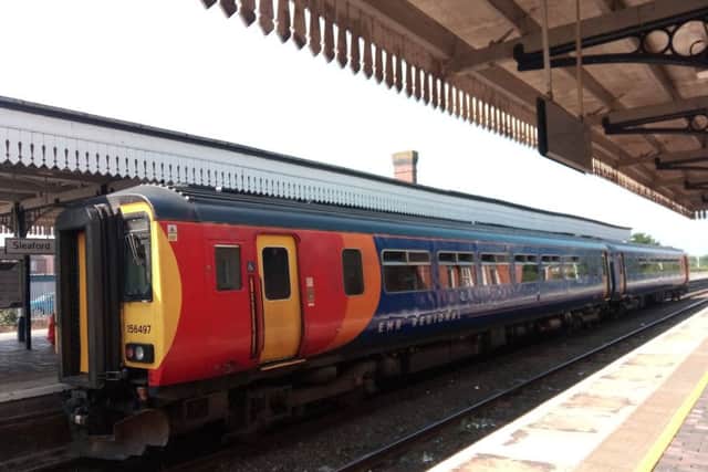 New East Midlands Railway livery on trains through Sleaford. EMN-190827-113046001