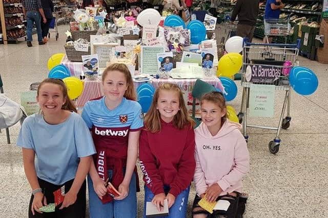 Kayleigh Holman and three other former William Alvey girls, Eden, Libby and Ruby doing their fund raiser. EMN-190827-140536001