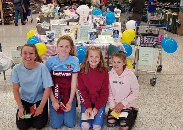 Kayleigh Holman and three other former William Alvey girls, Eden, Libby and Ruby doing their fund raiser. EMN-190827-140536001