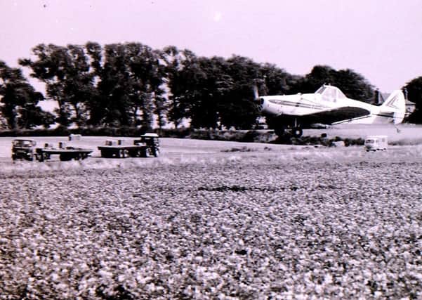 Aerial crop spraying near Sleaford in the 1960s. EMN-190826-164504001
