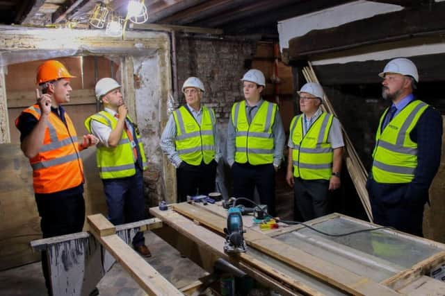 Members of Boston Borough Council's cabinet tour the Old Kings Head restoration site.