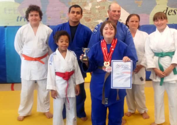 Georgina (centre) with other Judo club members.