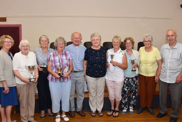 The Rev David Post of Middle Rasen presented the trophies to the winners. Also pictured are flower judges Cecile Povey and May Bennett, vegetable judge John Bennett and chairman Chris Raynor.
Photo by John Edwards EMN-190409-133909001