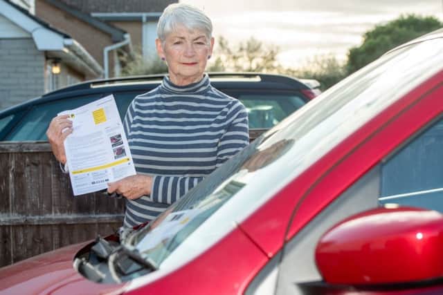 Jacky Merrison with her parking penalty notice. Picture: John Aron.