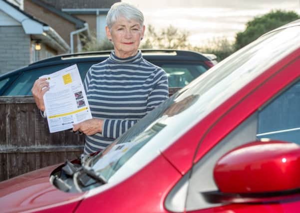Jacky Merrison with her parking penalty notice. Picture: John Aron.