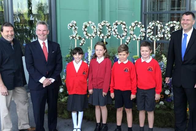 Pupils from St Andrew's C of E School, Leasingham unveil the living sculpture at the energy from waste plant with Coun Eddy Poll and Martin Hill from the county council and officials from CC Environment. EMN-190509-150856001