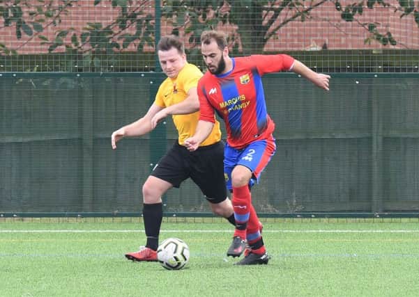 Northgate Olympic (red) v Kirton Reserves (yellow). Chris Hipkiss (red), Jack Reeson (yellow)