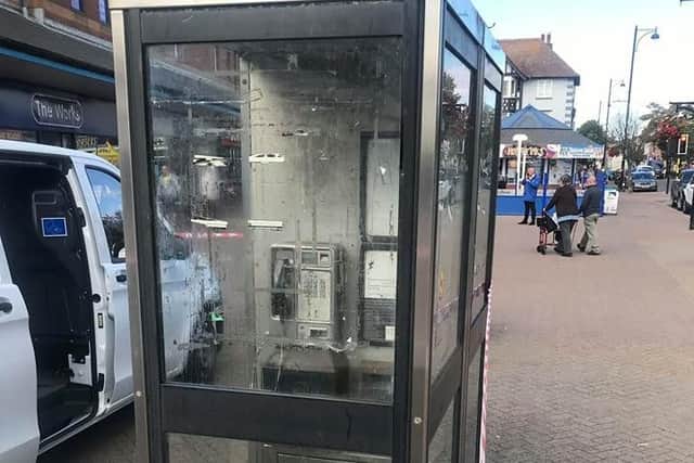 A phone box after being cleared by the Street Wardens.