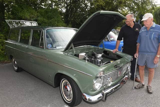 Sleaford historic car and motorcycle show. L-R Paul Mackley and Cecil Musson with Paul's 1966 Hilman Super Minx. EMN-190909-171530001