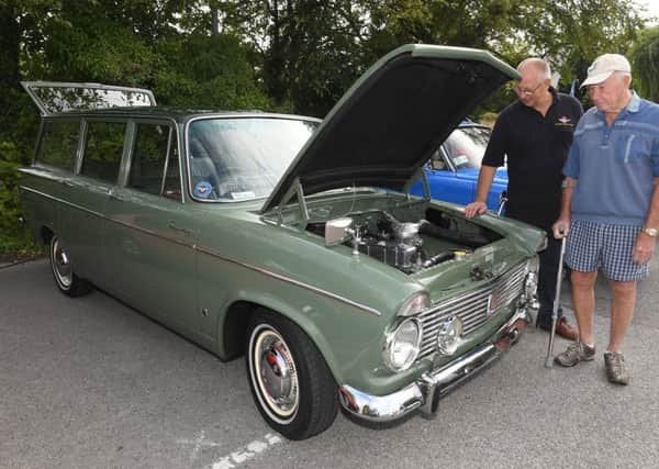 Sleaford historic car and motorcycle show. L-R Paul Mackley and Cecil Musson with Paul's 1966 Hilman Super Minx. EMN-190909-171530001