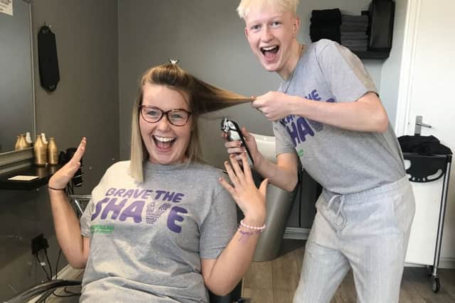Preparing to Brave the Shave for Macmillan - Abbie Wells, 20, and Billy Wright, 17. EMN-190909-154546001