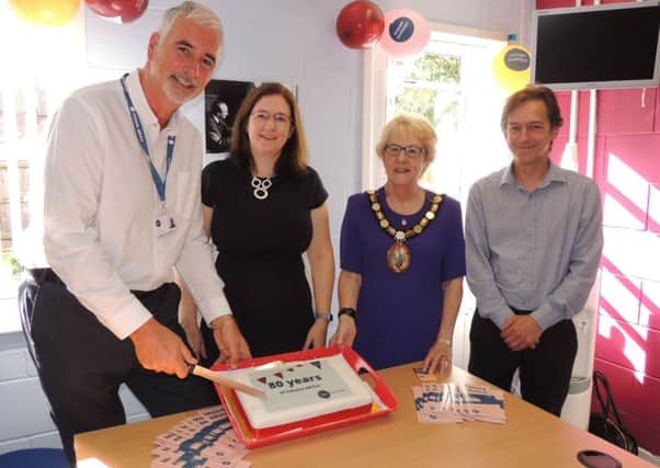 Cutting the 80th anniversary cake for Citizen's Advice. From left - CEO for Citizens Advice Mid Lincs Kingsley Taylor, MP Dr Caroline Johnson, NKDC chairman Coun Susan Waring and Citizens Advice Mid Lincs chairman Ben Ellis. EMN-190917-122909001