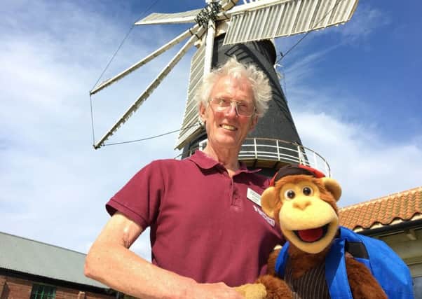 Heckington Windmill mill manager Jim Bailey with Milkshake Monkey.