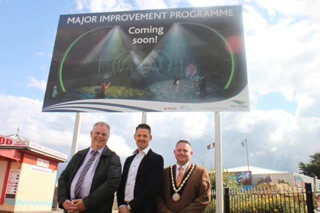 Councillor Steve Kirk, Sam Robbens and Councillor Mark Dannatt with an artist's impression of the completed work