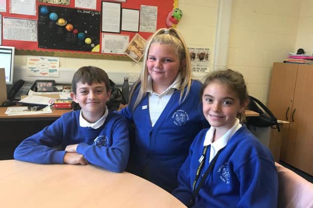 Pupils who helped launch Young Friends Against Scams (from left) Oliver Curtis, Summer Pettitt and Summer Watson).