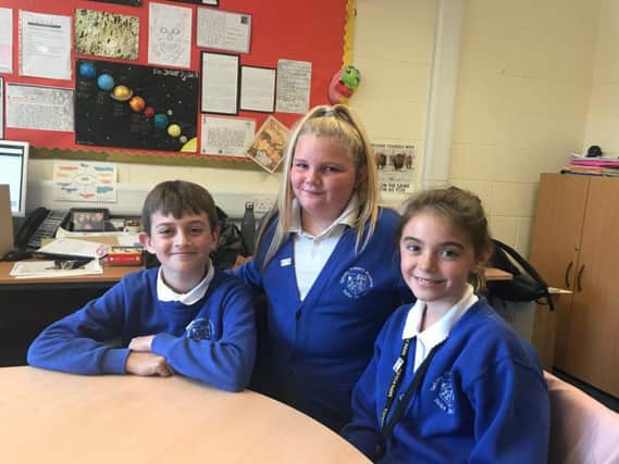 Pupils who helped launch Young Friends Against Scams (from left) Oliver Curtis, Summer Pettitt and Summer Watson).
