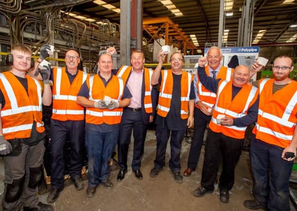All smiles: Management and staff celebrate the 40th anniversary of Polpypipe in Horncastle - and confirmations that the site faces a very  positive future