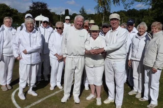 Tony Cross and Les Vogel of Branston are presented with the Invitation Day Trophy by Pauline Donner, chair of Woodhall Spa Croquet Club.