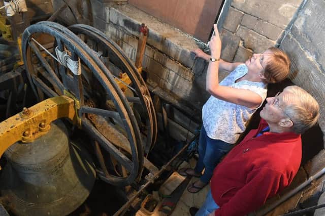 Heritage Open Day at Silk Willoughby Church. Bell Ringer Bruce Burman in the bell tower with Ruth Davies of Lenton. EMN-190916-173934001